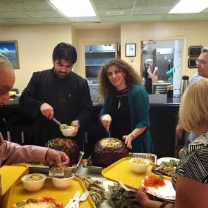 Father Paren and Yeretsgin Anna serve parishioners Ghapama and Jingalov Hats 